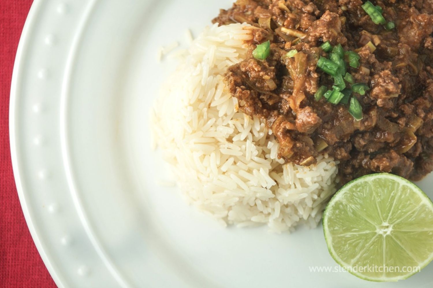 Thai Curry Ground Beef (Slow Cooker or Stovetop) Thai curry ground beef with red curry pasta and coconut milk served over a bed of white rice.