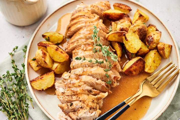 The Best Turkey Tenderloin Recipes Instant pot turkey tenderloin with potatoes and gravy on a plate.