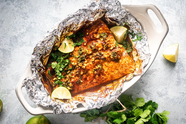 Cilantro Lime Salmon in Foil Cilantro lime salmon cooked in foil with garlic, lime juice, cilantro, and honey.