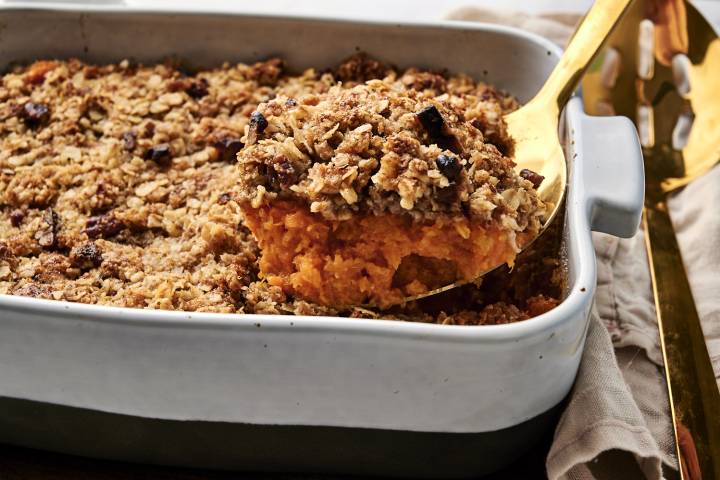 Healthy Sweet Potato Casserole Healthy sweet potato casserole being served with a spoon.