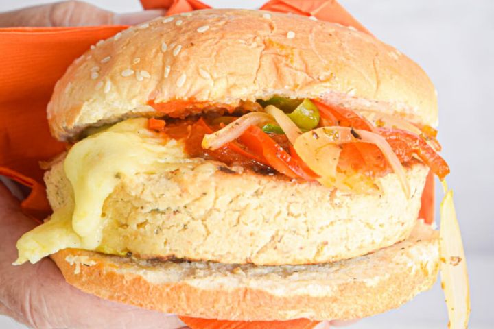 White Bean Pizza Burgers Vegetarian pizza burger with peppers, onions, mozzarella cheese, and marinara sauce.