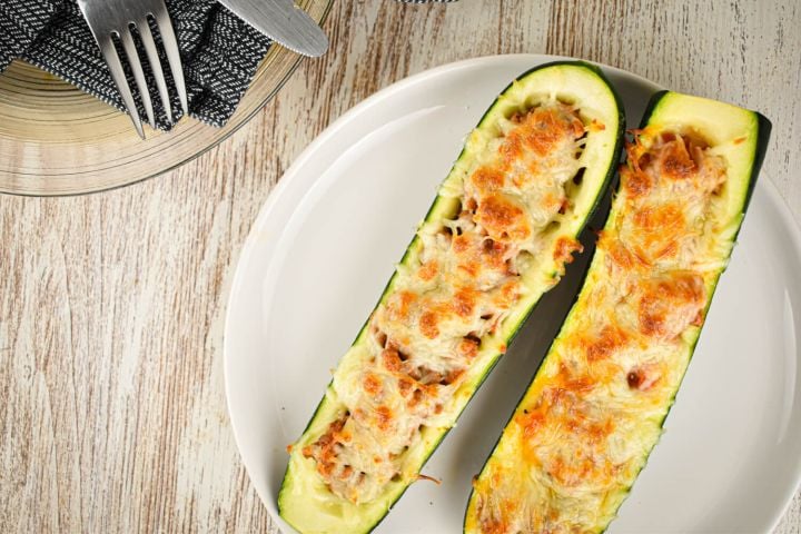 Zucchini and Ground Turkey Pizza Boats Zucchini and Ground Turkey Pizza Boats in a glass baking dish.