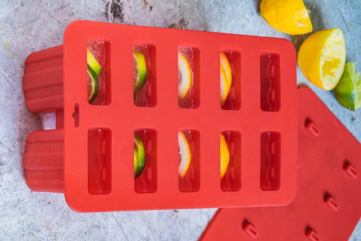 Lemon Lime Popsicles Lemon and lime juice in a red popsicle mold.
