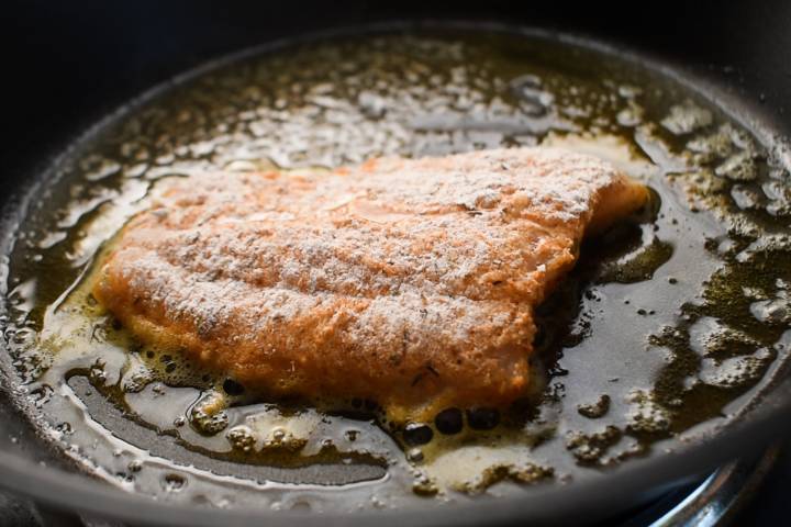 Pan Seared Cod Cod being pan seared in a hot skillet.