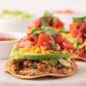 50 Easy & Healthy Ground Turkey Recipes Ground turkey tostadas with beans, ground turkey, avocado, tomatoes, cheese, and cilantro.