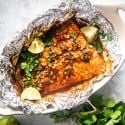 Cilantro Lime Salmon in Foil Cilantro lime salmon cooked in foil with garlic, lime juice, cilantro, and honey.