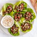 Healthy Ground Beef Recipes Asian ground beef lettuce wraps with bell peppers, peanuts, and green onions.