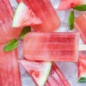Watermelon Mint Popsicles Watermelon popsicles with fresh watermelon and honey with ice cubes and fresh watermelon slices.