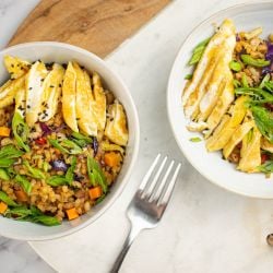 Egg Fried Rice Vegetable fried rice with brown rice, eggs, carrots, peas, and cabbage in a cilantro.