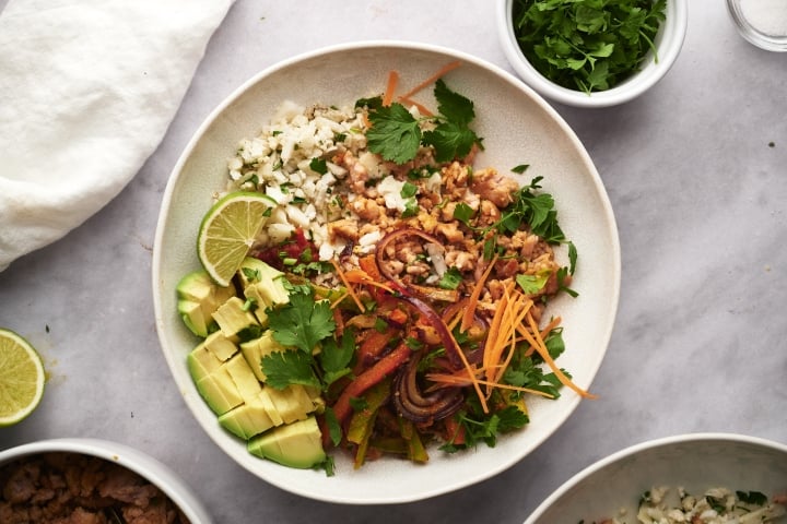 Taco Bowls with Cauliflower Rice Taco bowls with cauliflower rice, peppers, onions, and ground turkey.