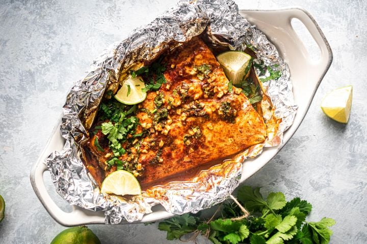 Cilantro Lime Salmon in Foil Cilantro lime salmon cooked in foil with garlic, lime juice, cilantro, and honey.