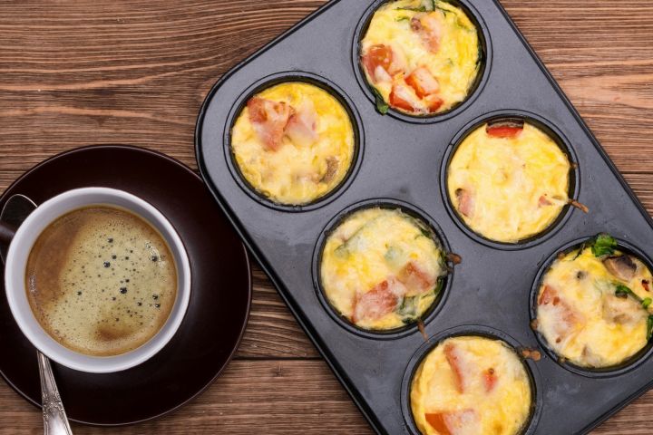 Ham and Cheese Egg Muffins Egg Muffins with ham and cheese in a muffin tin.