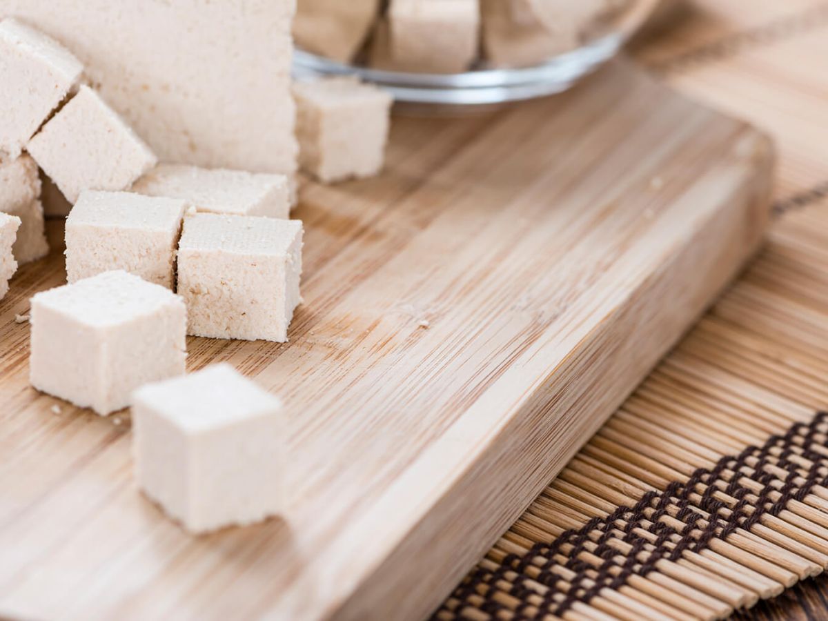 Healthy Tofu Recipes Diced tofu on a wood cutting board