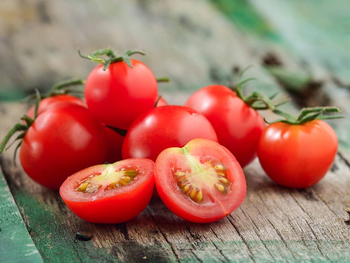 Healthy Tomato Recipes Fresh, ripe cherry tomatoes on a wood table