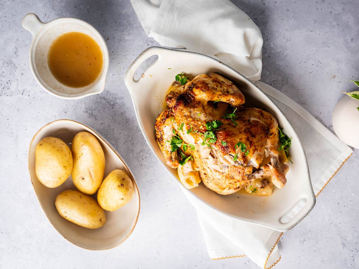 Chicken Dinners Slow cooker rotisserie chicken with a homemade spice rub, lemon, and parsley with potatoes on the side.