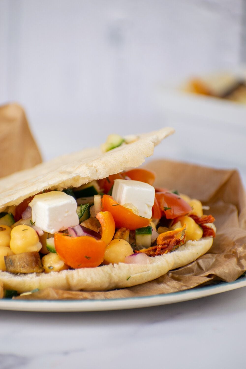 Greek Chickpea Tostadas with eggplant, chickpeas, and Greek salad on toasted pita bread.