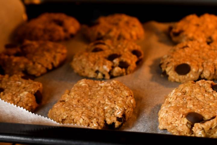 Banana oatmeal cookies with chocolate chips baking in the oven.