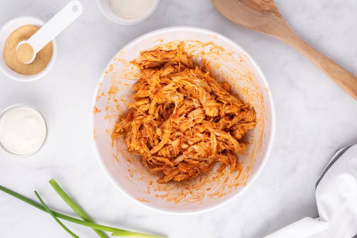 Shredded chicken tossed with buffalo sauce, butter, and spices.