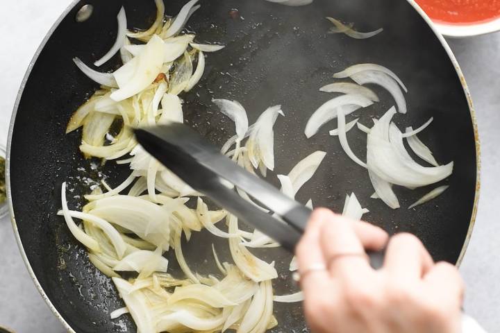 Onions cooking in a skillet. 