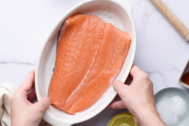 Raw salmon in a baking dish.