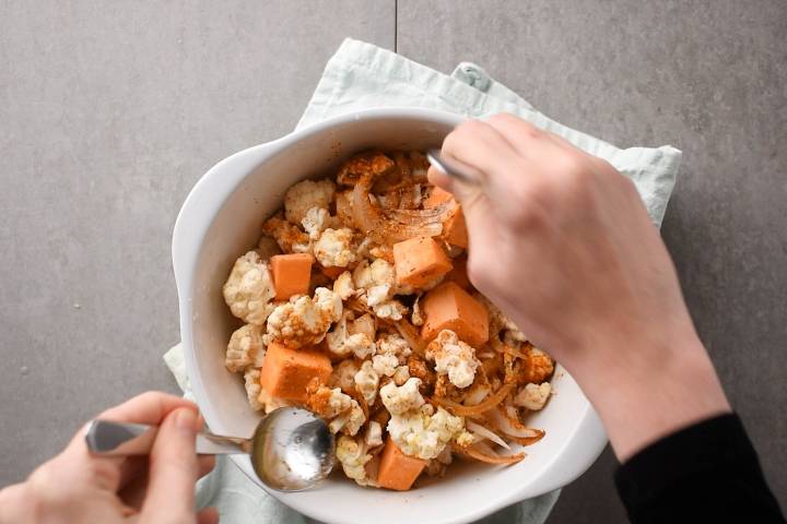Sweet potatoes, cauliflower, and red onions tossed in olive oil and taco seasoning.